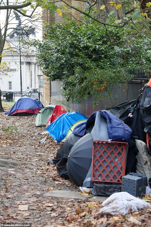 Squalid tents line a path in Hyde Park, supposedly one of London's scenic attractions