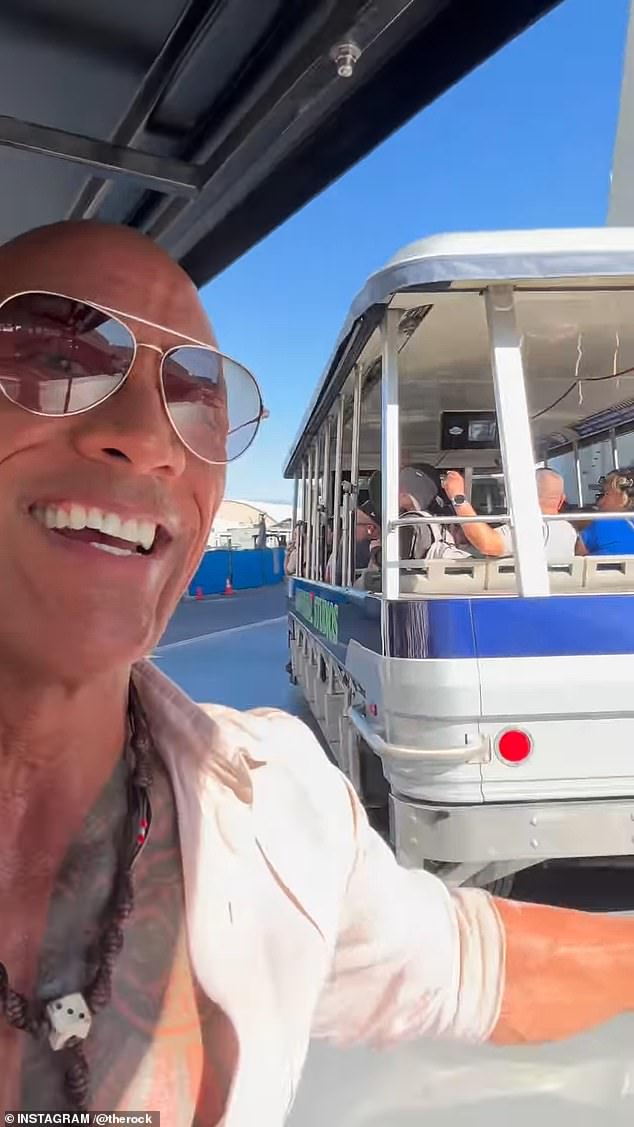 The international superstar greeted thrilled fans riding on a seperate tram, in a clip posted to his 391 million followers