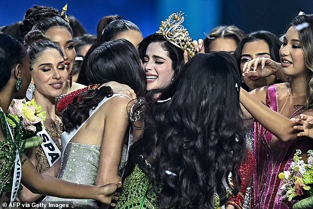 Miss Mexico Fatima Bosch (C) is surrounded by contestants as she celebrates winning the 2025 Miss Universe pageant in Nonthaburi, north of Bangkok, on November 21, 2025