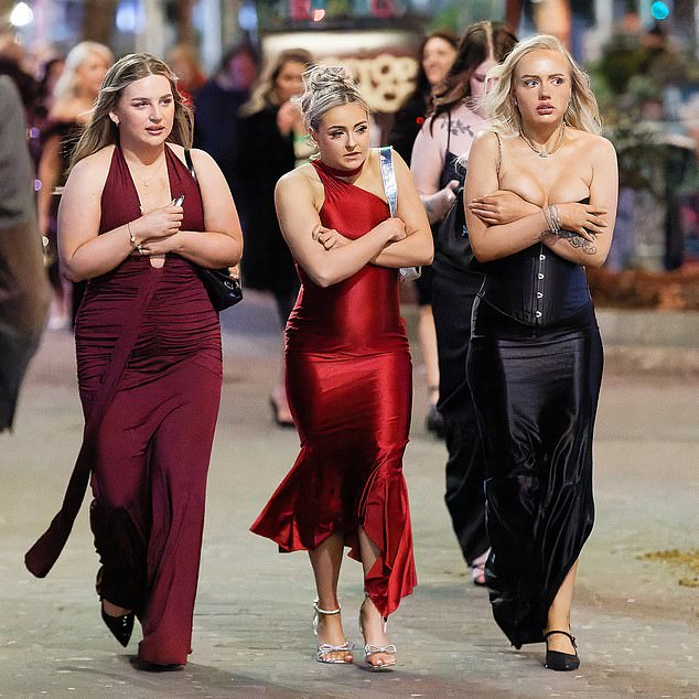 The Welsh city has become inextricably linked with the wine over the years (pictured: revellers braving the cold last night)