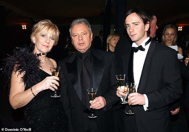 Christian pictured with his parents Jackie and Tony in 2003 as they attended a ball in London