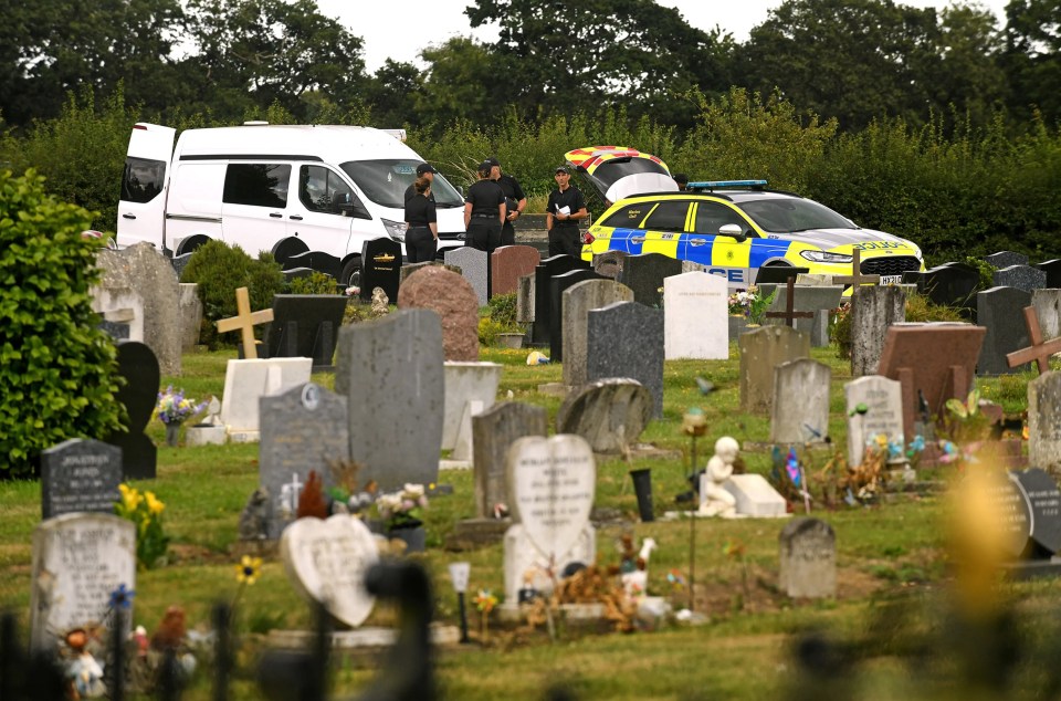 Police investigating a murder at a cemetery.