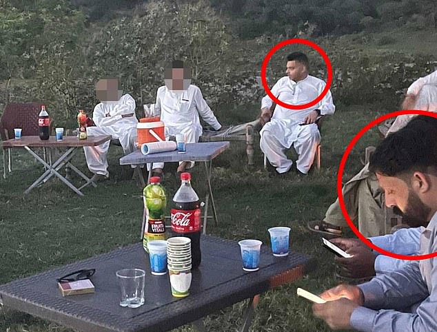 Cllr Zaffar (rear, in white) pictured at a social gathering celebrating Eid with Billu (front) in Kashmir in June 2023. He claims to have known nothing of Billu's criminal allegations