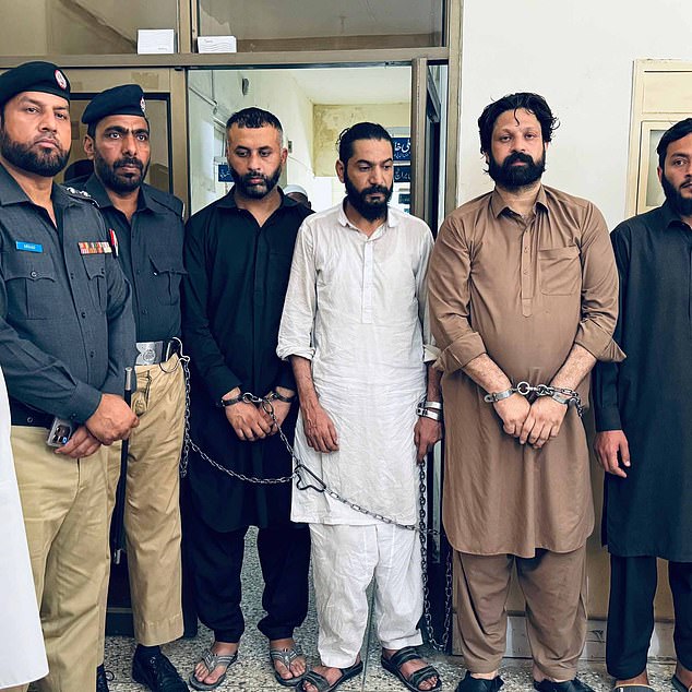 Billu pictured in a brown robe in April this year after being arrested on suspicion of masterminding an international drug ring from his base in Kashmir