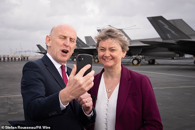 John Healey with Foreign Secretary Yvette Cooper onboard the aircraft carrier HMS Prince of Wales earlier this week