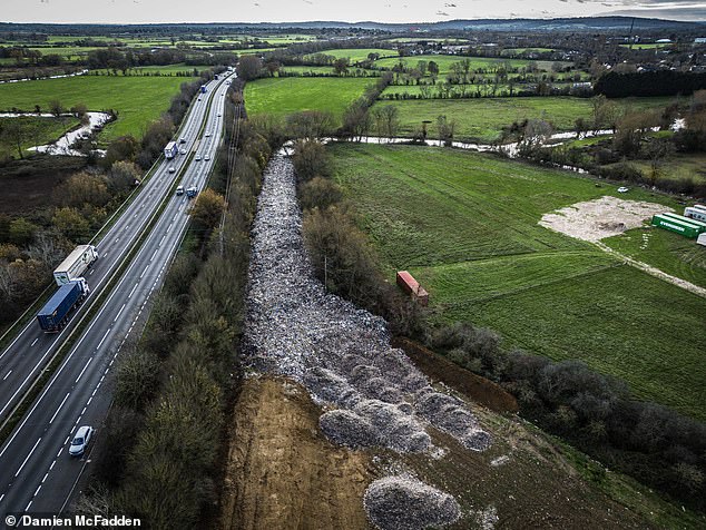 This mountain of stinking, toxic waste sits on greenbelt land adjacent to both the A34 dual carriageway and the River Cherwell, which later joins the Thames