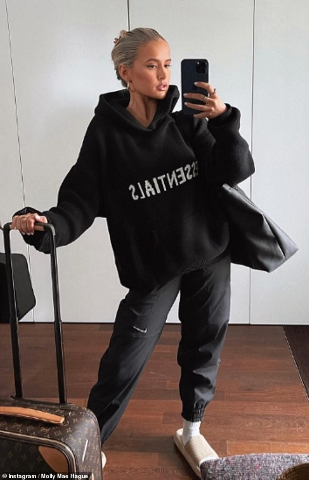 Influencer Molly-Mae Hague posted a picture on her Instagram sporting an Essentials hoodie and wheeling a Louis Vuitton case