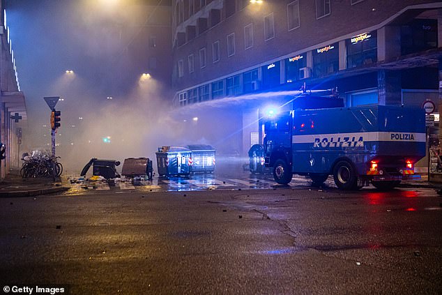 Riot police use water cannons to disperse pro-Palestinian supporters during a protest near the Virtus Arena