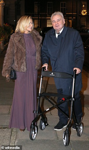 Completing the outfit with a pair of gold heels and a black leather clutch bag, she appeared in great spirits beside her partner