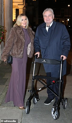 Meanwhile Eamonn wrapped up in a navy coat