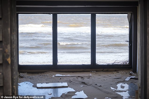 This abandoned property directly behind his has become a hive of anti-social behaviour