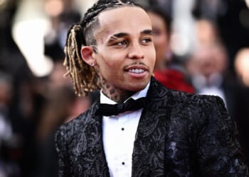 Rapper, 26, who 'kidnapped and beat teen fan who tried to take a photo of him' charged after cops raided star's home