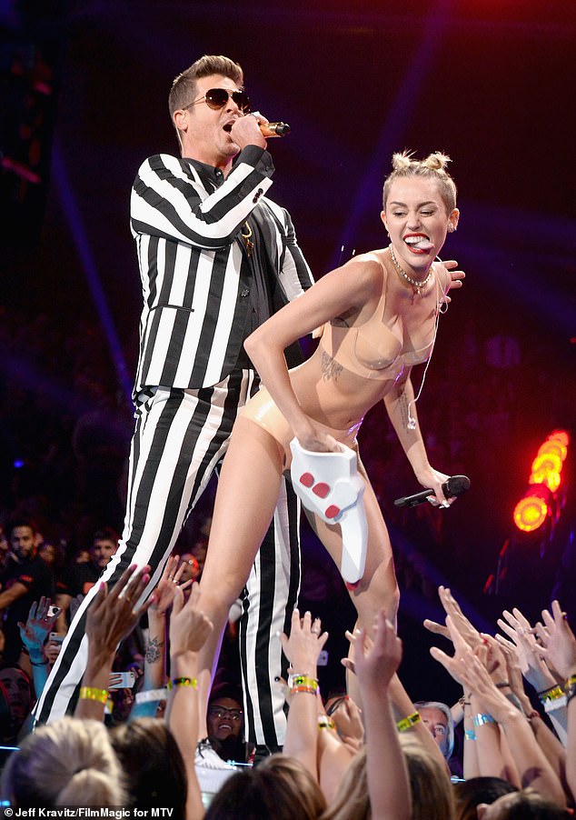 Miley Cyrus starred in an incredibly controversial twerk and grinding-filled performance with Robin Thicke at the 2013 MTV Video Awards (pictured)