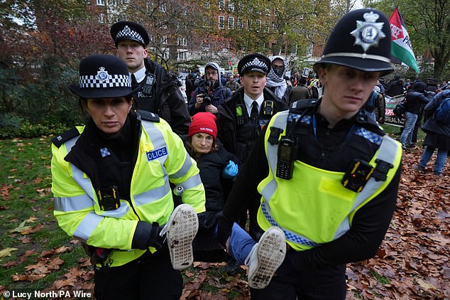 The Met confirmed that arrests were under way, saying: 'Officers have begun making arrests for expressing support for proscribed terror organisation Palestine Action at the protest organised by Defend Our Juries'