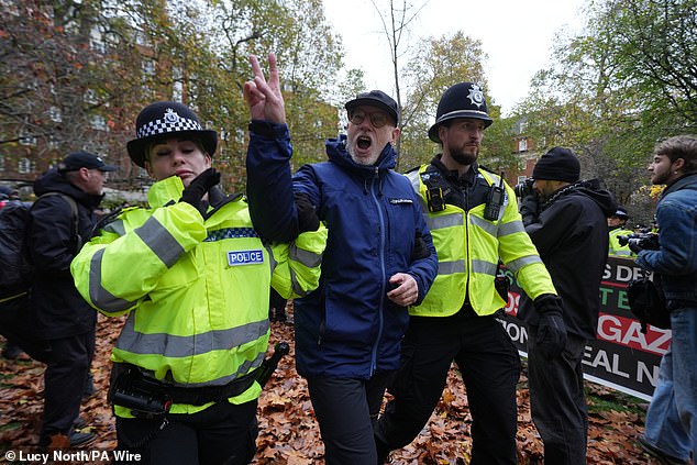 Surrounding demonstrators clapped and thanked those being led away