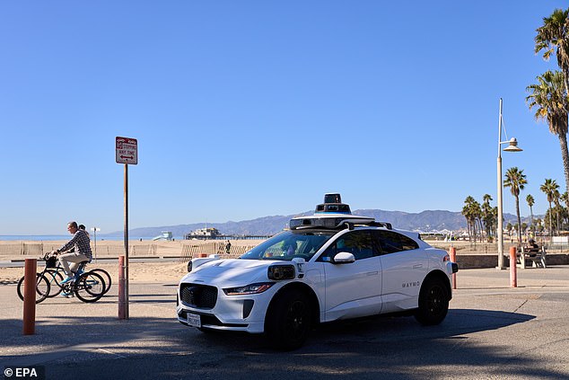 Today Waymo claims its vehicles have 79 per cent fewer accidents involving airbag deployment than human drivers. Pictured: A Waymo car driving through Los Angeles