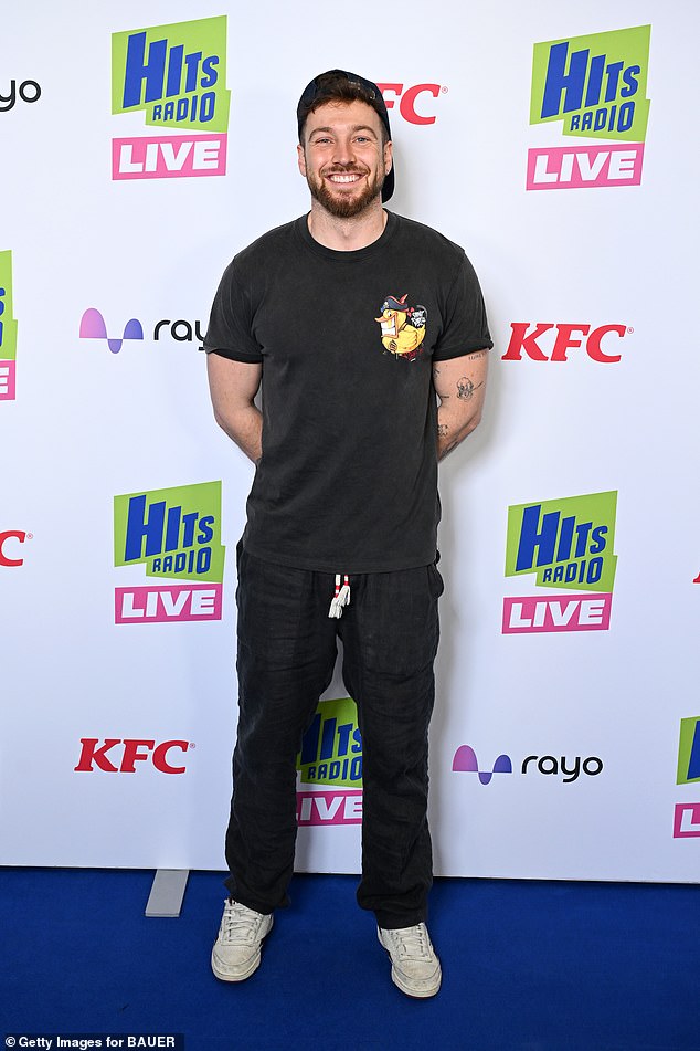 Sam, 33, cut a laid-back figure in a black graphic T-shirt and jeans as he graced the red carpet