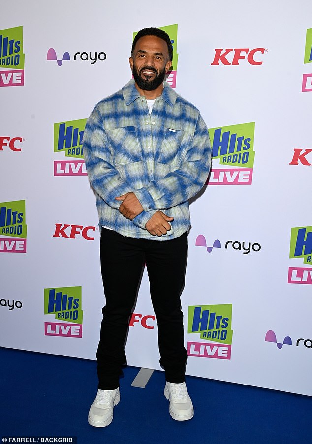 while Craig, 44, kept things relaxed in a blue checked shirt and black jeans