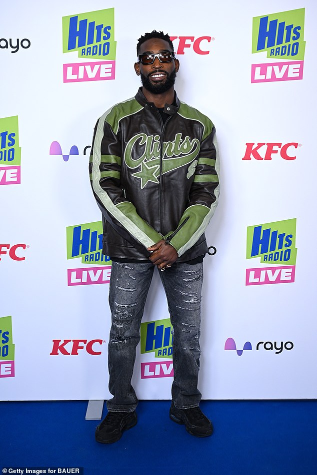 While Tinie, 37, rocked a black-and-green biker jacket and ripped jeans, posing up a storm for the cameras