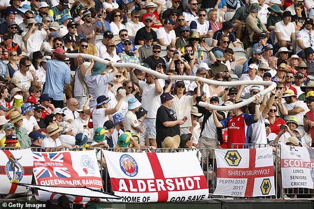 Pictured: Fans in a section with a large Barmy Army presence show off a huge beer snake made out of empty cups. Several spectators at the ground said objects were thrown when the snakes started to get confiscated