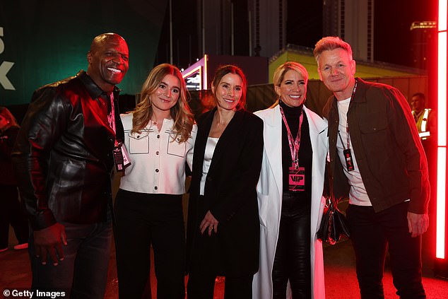 The family posed with Terry Crews at the F1 event