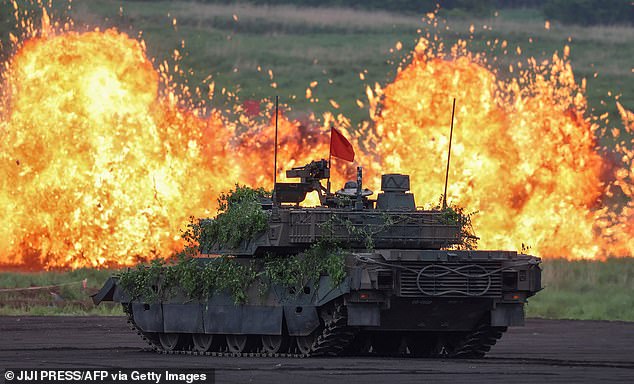 A Japan Ground Self Defence Force battle tank taking part in a military exercise in June. The country has warned that an invasion of Taiwan would result in a military confrontation