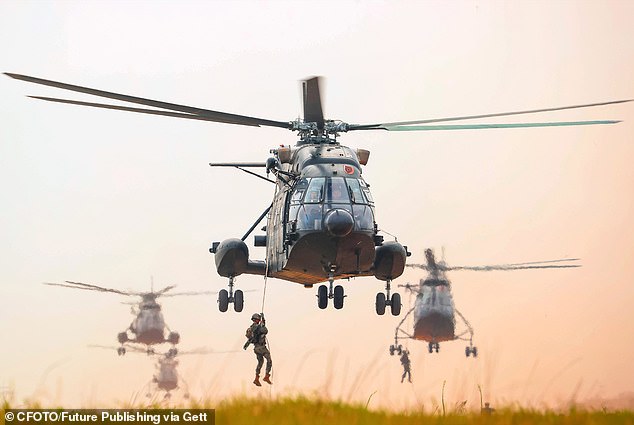 Chinese soldiers conduct aerial landing behind enemy lines during a live fire exercise in November 2025