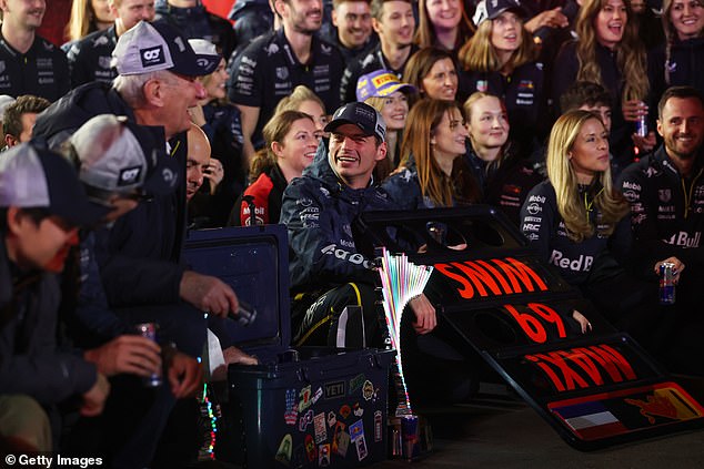 Max Verstappen is all smiles with his team as he celebrates his victory in Las Vegas