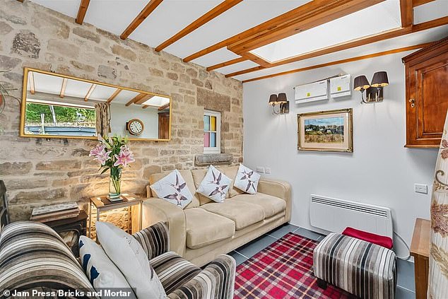 It is located in the picturesque town of Wirksworth, north of Derby. One home hunter joked: 'The UK housing market is crazy. Over £220,000 for this. 'Which is essentially a shed'