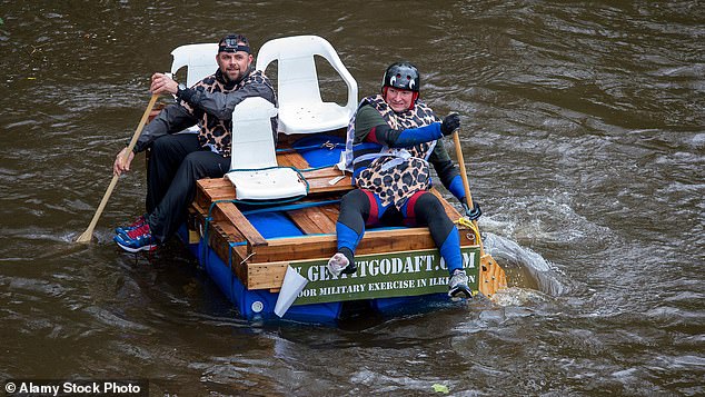 The tradition was started by scuba-diving friends who wanted to something to do in the winter, and has raised more than £150,000 since it started, with last year's event raising £3,393 (Pictured: The Matlock Boxing Day Raft Race 2016)