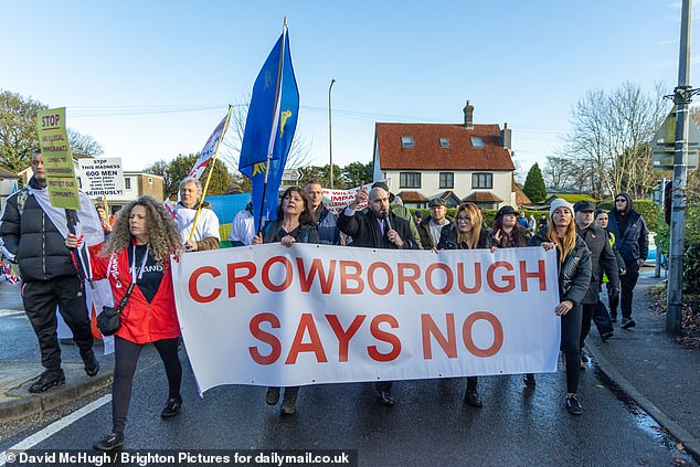 UKIP Leader Nick Teconi joined the protesters today wearing numbers to signify the amount of asylum seekers expected at Crowborough Army Camp