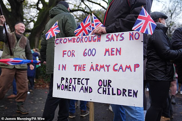 A sign during an anti-immigration protest near Crowborough Training Camp in East Sussex