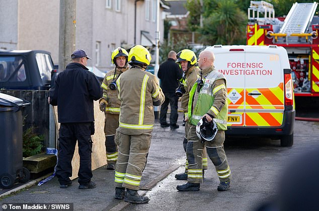 Firefighters on the scene after the house fire on Holywell Avenue in Ashby-de-la Zouch. A man has since been charged