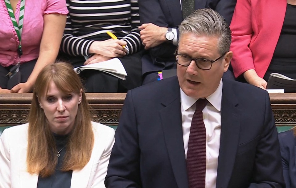 Britain's Prime Minister Keir Starmer speaking during Prime Minister's Questions, flanked by Deputy Prime Minister Angela Rayner.