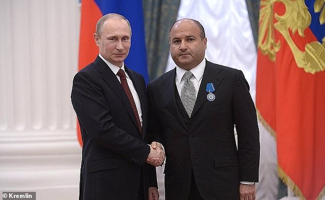 Georgy Bedzhamov (right), who was granted permission by the High Court to sell 17 Belgrave Square in 2022, with Vladimir Putin in 2014