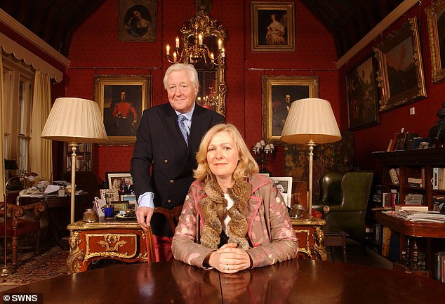 Sir Benjamin pictured in his ornate Somerset estate with previous partner Kirsten Hughes