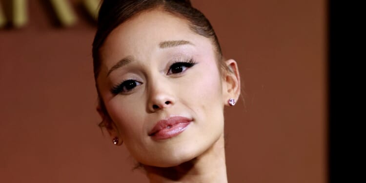 Prankster who lunged at singer Ariana Grande has been kicked out of Singapore and banned from returning