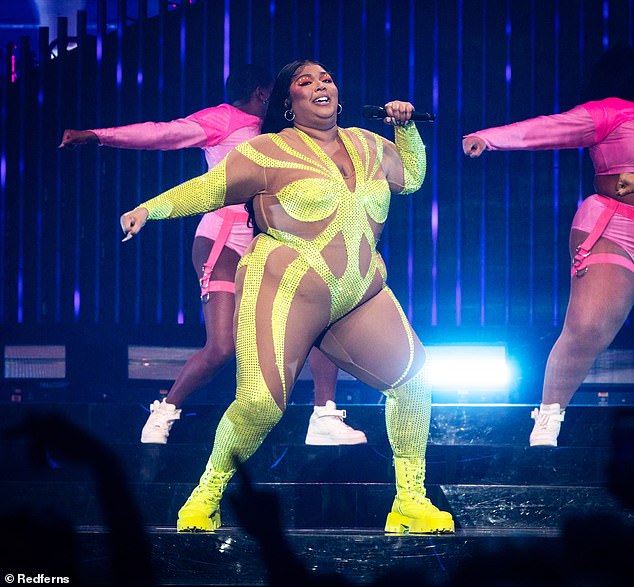 Lizzo later realized she had been using the weight as a shield and stressed slimming down was 'energetic... not vain'; pictured 2023