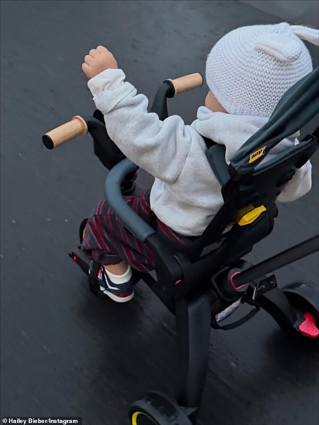 Baldwin - who boasts 79.1M social media followers - posted a snap of their son Jack Blues rolling along in a tricycle while sporting a bunny-eared beanie