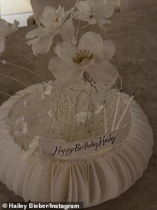 It's unclear how precisely Baldwin celebrated, but she shared glimpses of a white floral centerpiece