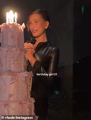 'Birthday girl' poses with her towering cake