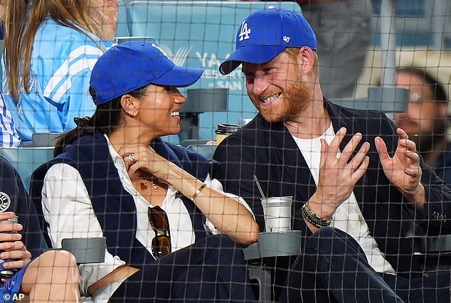 The Duke and Duchess of Sussex sit during the eighth inning in Game 4 of baseball's World Series between the Los Angeles Dodgers and the Toronto Blue Jays in Los Angeles, Tuesday, October 28, 2025