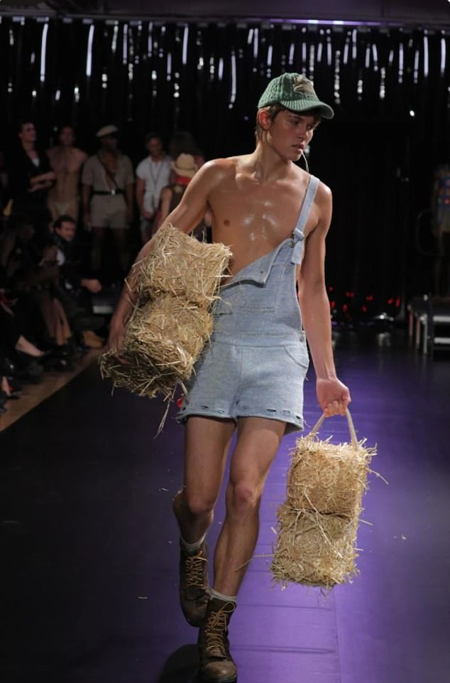 Pictured: A male model wearing some of Mr Schmidt¿s fashion line on the catwalk in New York