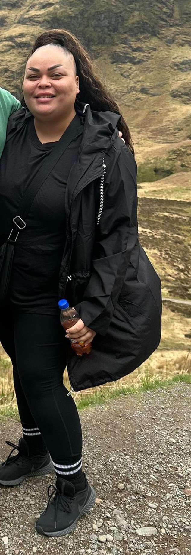 Sherine Lionel pictured in May 2023 on a mountain in the Scottish Highlands. She had asked the tour guide to take a photo of her with her partner but later didn¿t realise it was actually her in the photo because of her weight