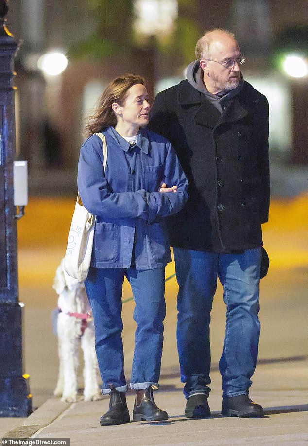 As if the kissing wasn't already enough, the two strolled arm-in-arm on the walk with a small dog