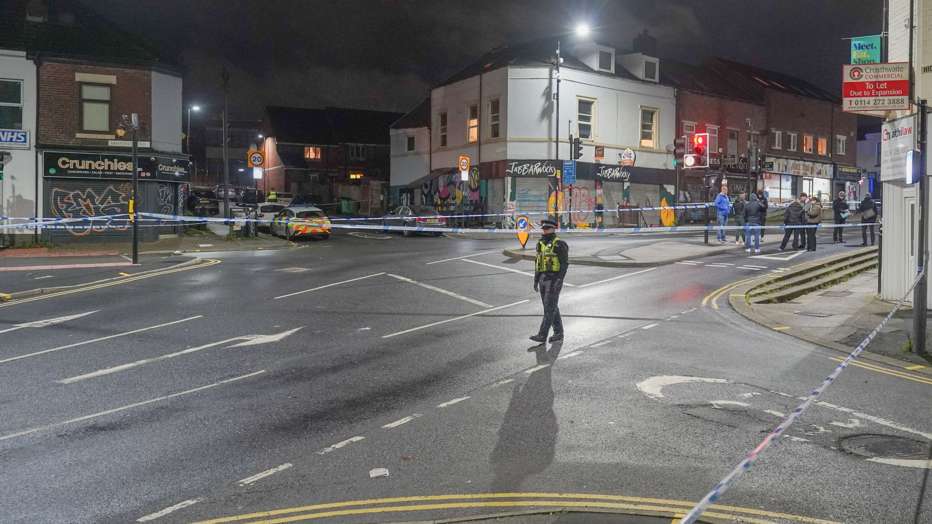 Boy, 16, fights for his life after being shot on popular shopping street as cops urgently investigate horror attack