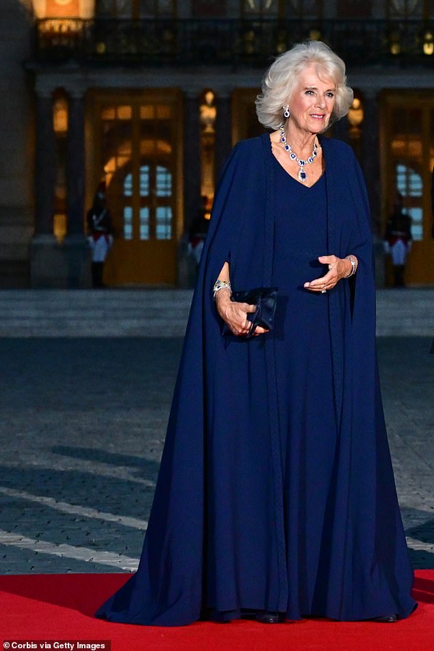 Queen Camilla felt able to don a custom Dior cape-dress creation when it came time to attend a black-tie dinner at Versailles in 2023