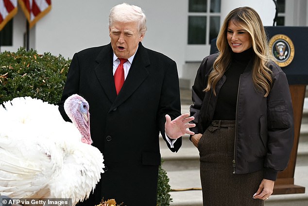 First Lady Melania Trump looks on as her husband pardons Gobble
