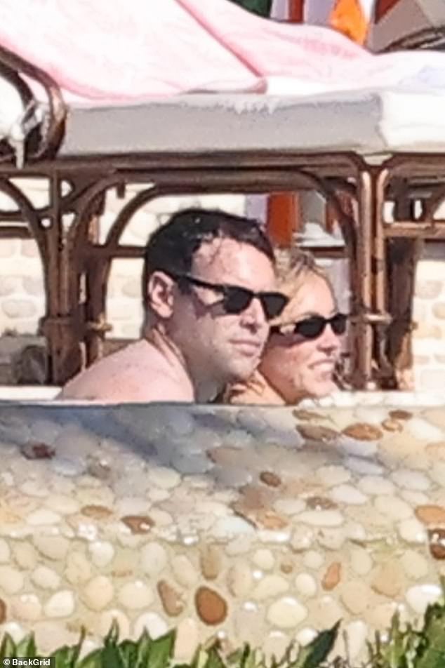 The couple were surrounded by friends but managed to steal an intimate moment