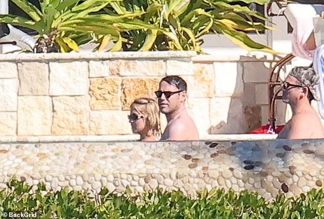 The couple didn't seem to have much time together as they were surrounded by friends